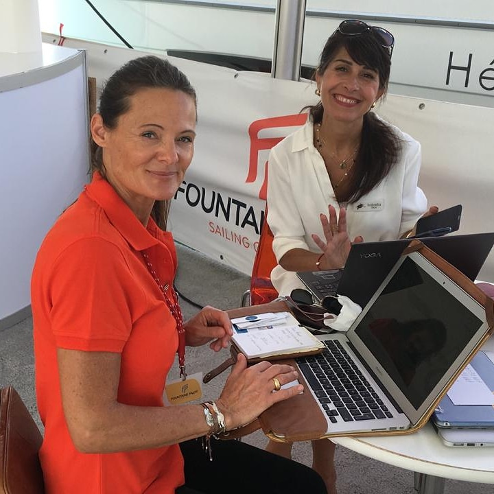 Anne-Sophie working with colleague of Dream Yacht Charter