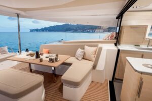 Cockpit table and galley on board Fountaine Pajot FP 48 - For sale in the Caribbean by yacht dealer Caribbean Multihulls